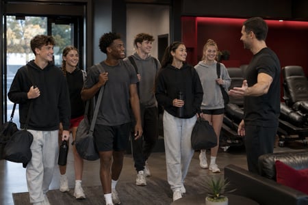 Coaches reviewing recovery options for their athletes